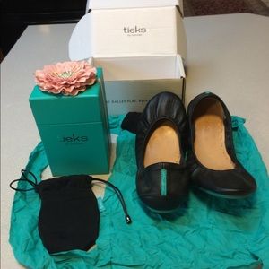 1 pair of matte black Tieks ballet flats, size 11.